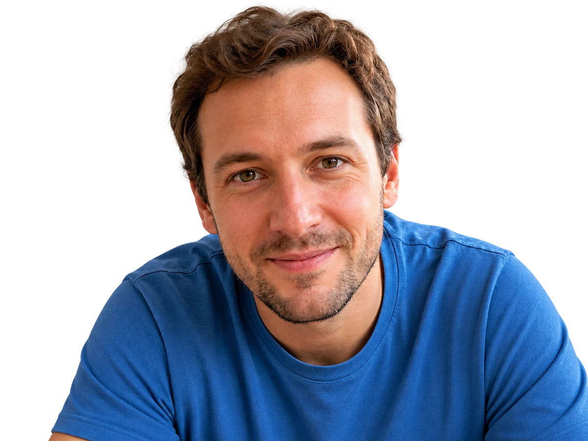 A smiling parent, close up, looking at the camera